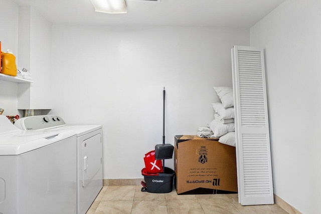 laundry room with light tile patterned flooring and independent washer and dryer