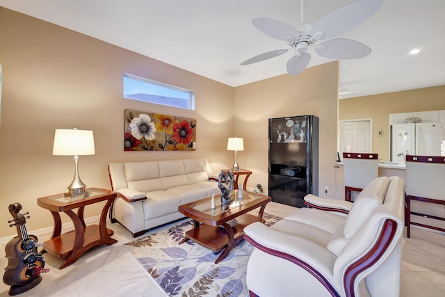 tiled living room featuring ceiling fan