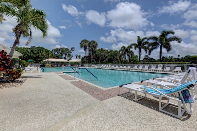 view of swimming pool with a patio