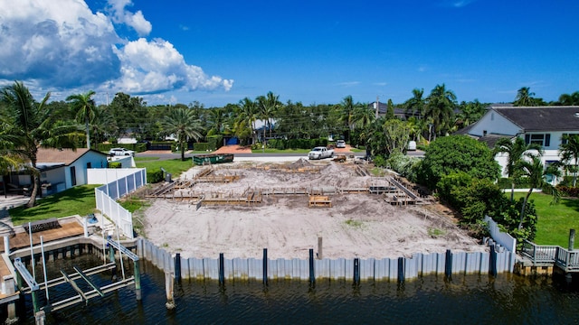 view of community with a boat dock and a water view