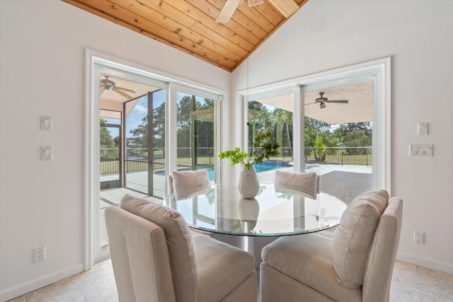 tiled dining room with wooden ceiling and vaulted ceiling