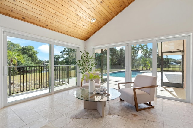 sunroom / solarium with lofted ceiling, french doors, and wooden ceiling