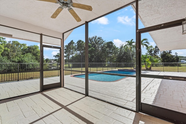 view of pool featuring ceiling fan and a patio area