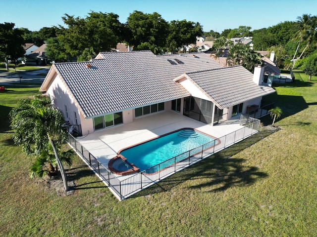 view of pool featuring a patio area and a lawn