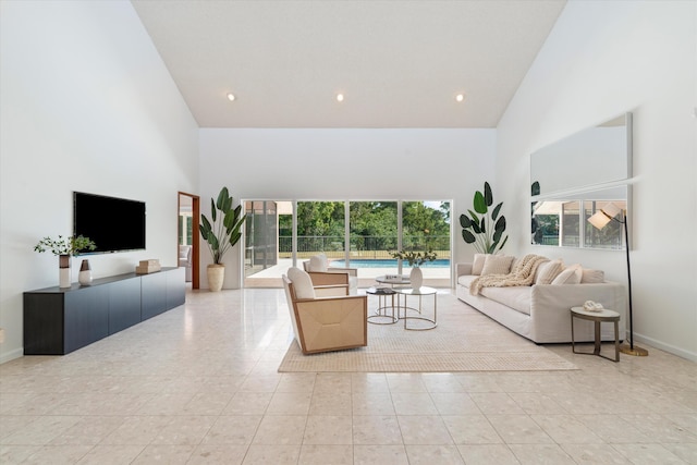 tiled living room with high vaulted ceiling