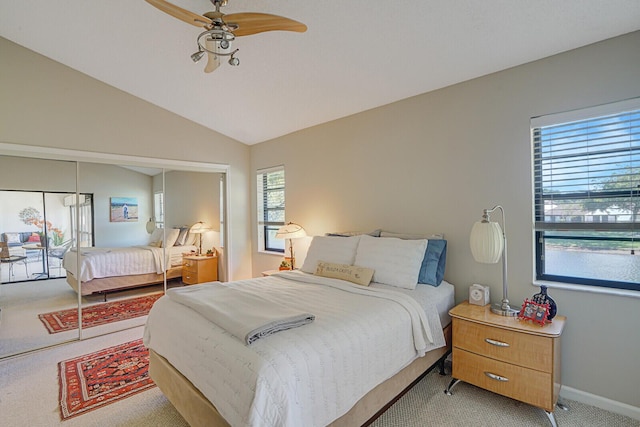 bedroom featuring light colored carpet, vaulted ceiling, and ceiling fan