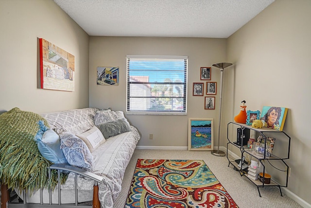 carpeted bedroom featuring a textured ceiling