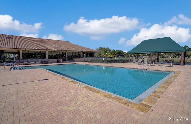 view of swimming pool with a gazebo and a patio