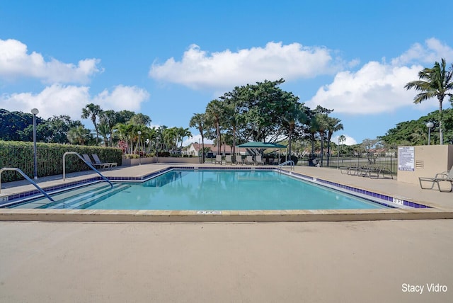 view of swimming pool with a patio area