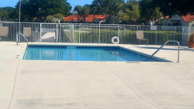 view of pool featuring a patio