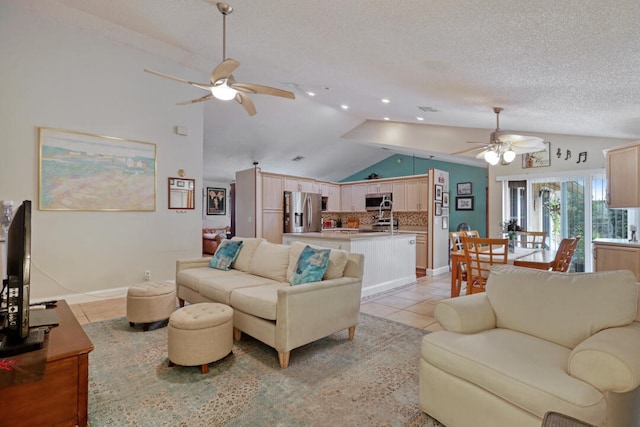 tiled living room with ceiling fan, lofted ceiling, and a textured ceiling