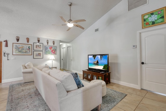 living room featuring ceiling fan, high vaulted ceiling, light tile patterned flooring, and a textured ceiling