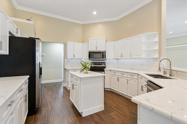 kitchen featuring dark hardwood / wood-style flooring, stainless steel appliances, white cabinetry, and sink