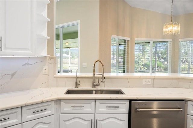 kitchen featuring dishwasher, white cabinetry, and sink