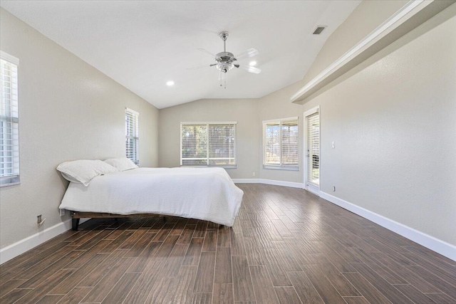 bedroom featuring ceiling fan, dark hardwood / wood-style floors, and vaulted ceiling