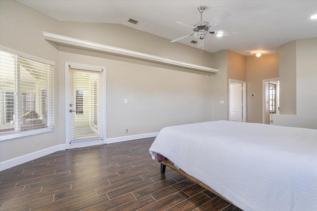 bedroom with ceiling fan, dark hardwood / wood-style floors, and lofted ceiling