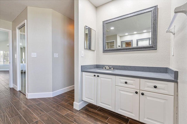 bathroom featuring hardwood / wood-style floors and vanity