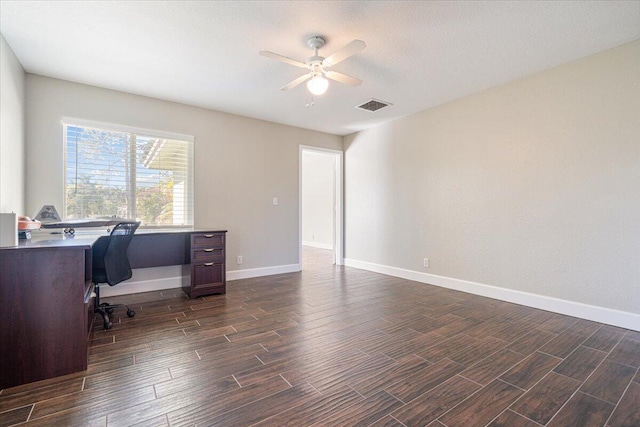 office space featuring ceiling fan and dark hardwood / wood-style flooring