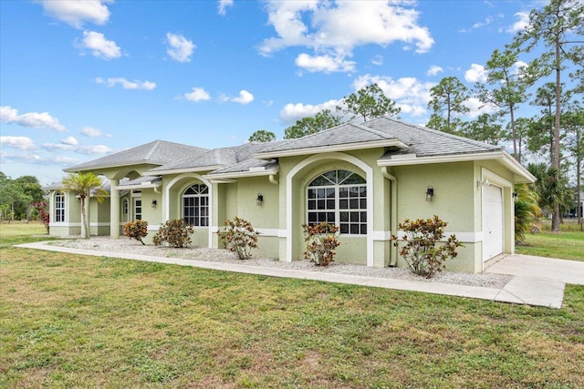 exterior space featuring a front lawn and a garage