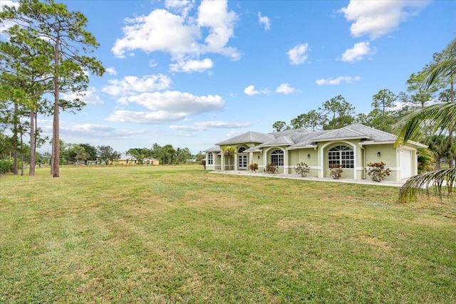 view of yard featuring a garage