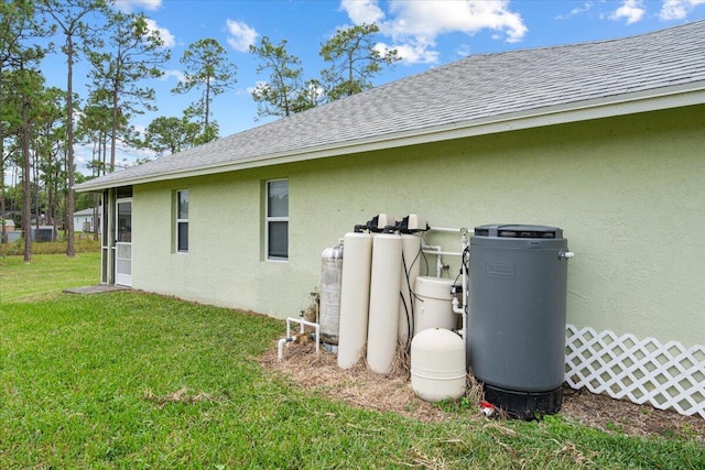 view of home's exterior featuring a yard