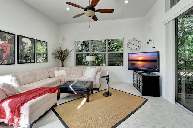 tiled living room featuring ceiling fan