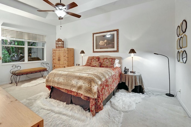 bedroom with ceiling fan and light carpet