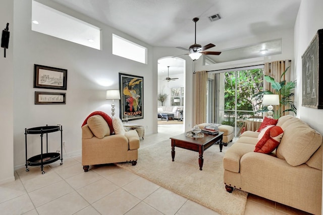 tiled living room with ceiling fan