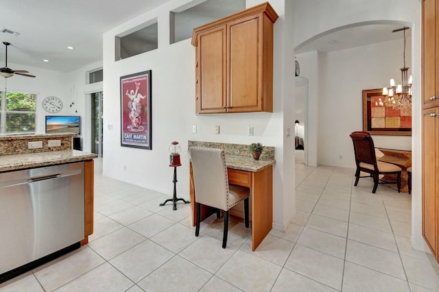 kitchen with stainless steel dishwasher, ceiling fan with notable chandelier, light tile patterned flooring, and light stone countertops