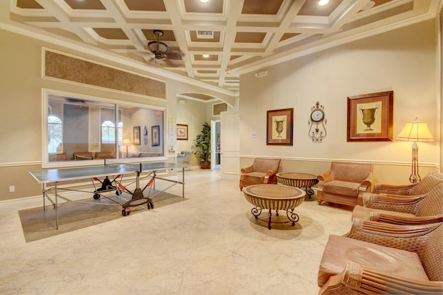 playroom with a towering ceiling, crown molding, and coffered ceiling