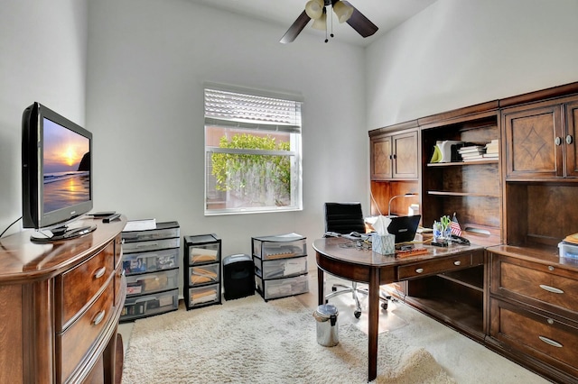 home office featuring light colored carpet and ceiling fan