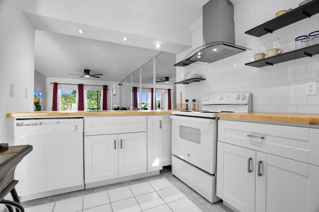 kitchen featuring white appliances, island range hood, ceiling fan, and white cabinets