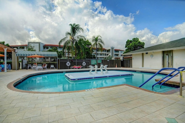 view of swimming pool featuring a patio