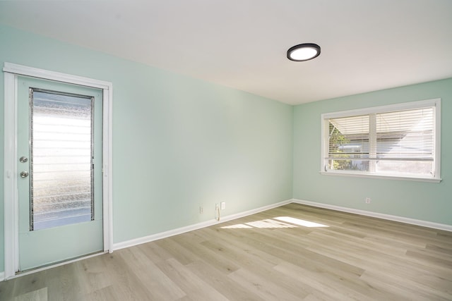 spare room featuring light hardwood / wood-style flooring