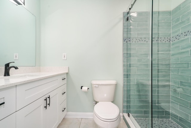 bathroom featuring tile patterned flooring, a shower with door, vanity, and toilet