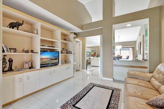 living room featuring light tile patterned floors and a textured ceiling