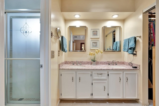 bathroom with tile patterned flooring and vanity