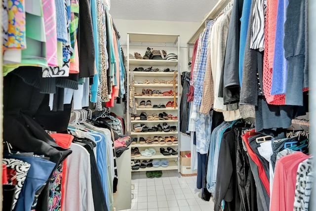 spacious closet with light tile patterned flooring