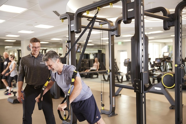 exercise room with a paneled ceiling