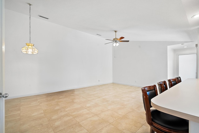 dining area featuring ceiling fan, high vaulted ceiling, and light tile patterned flooring