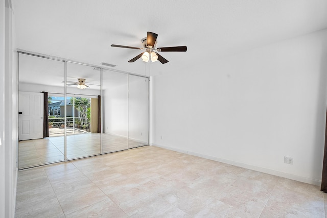 unfurnished bedroom featuring a closet, access to outside, and ceiling fan