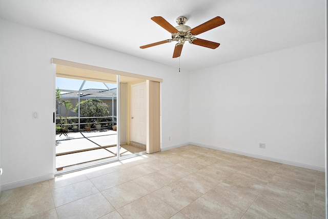 spare room with light tile patterned floors and ceiling fan