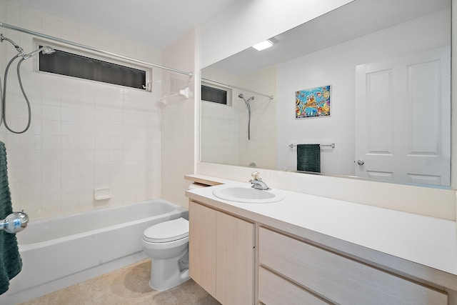 full bathroom with tile patterned flooring, vanity, toilet, and tiled shower / bath