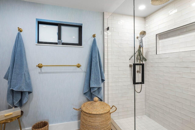 bathroom with a shower with shower door