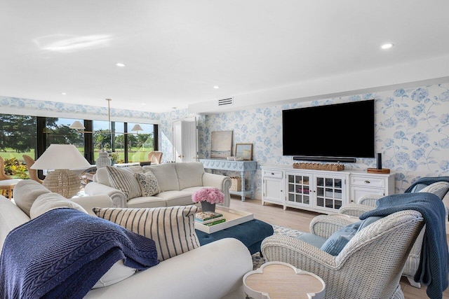 living room with light hardwood / wood-style flooring