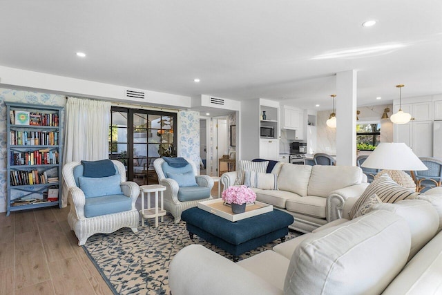 living room with light hardwood / wood-style flooring