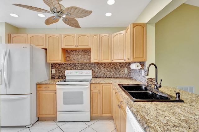 kitchen featuring sink, tasteful backsplash, white appliances, light brown cabinetry, and light tile patterned flooring