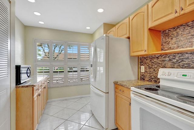 kitchen featuring light brown cabinetry, white appliances, tasteful backsplash, and light tile patterned floors