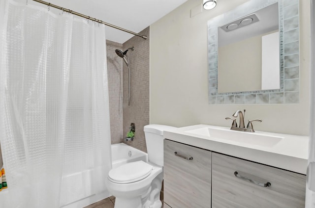 full bathroom with tile patterned flooring, shower / tub combo, vanity, and toilet