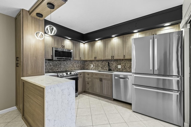 kitchen featuring light stone countertops, sink, hanging light fixtures, stainless steel appliances, and light tile patterned flooring